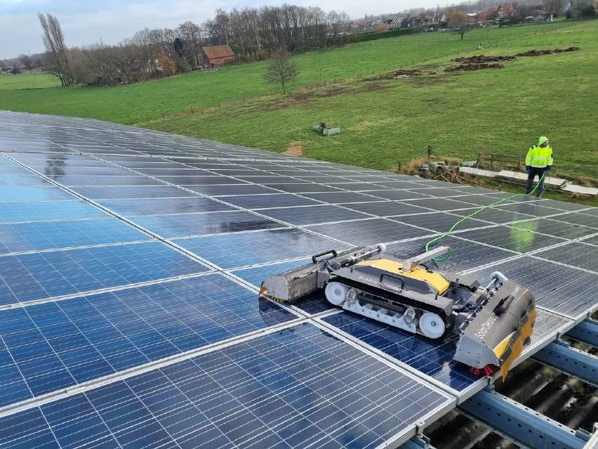 SolarCleano robot cleaning a commercial rooftop solar array